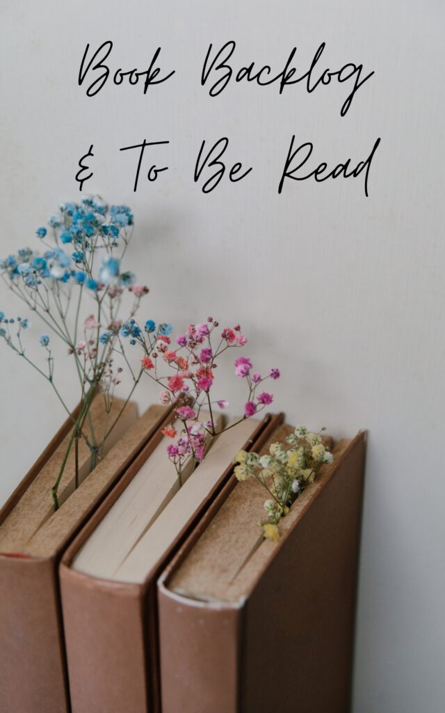 Three vintage books with dried flowers